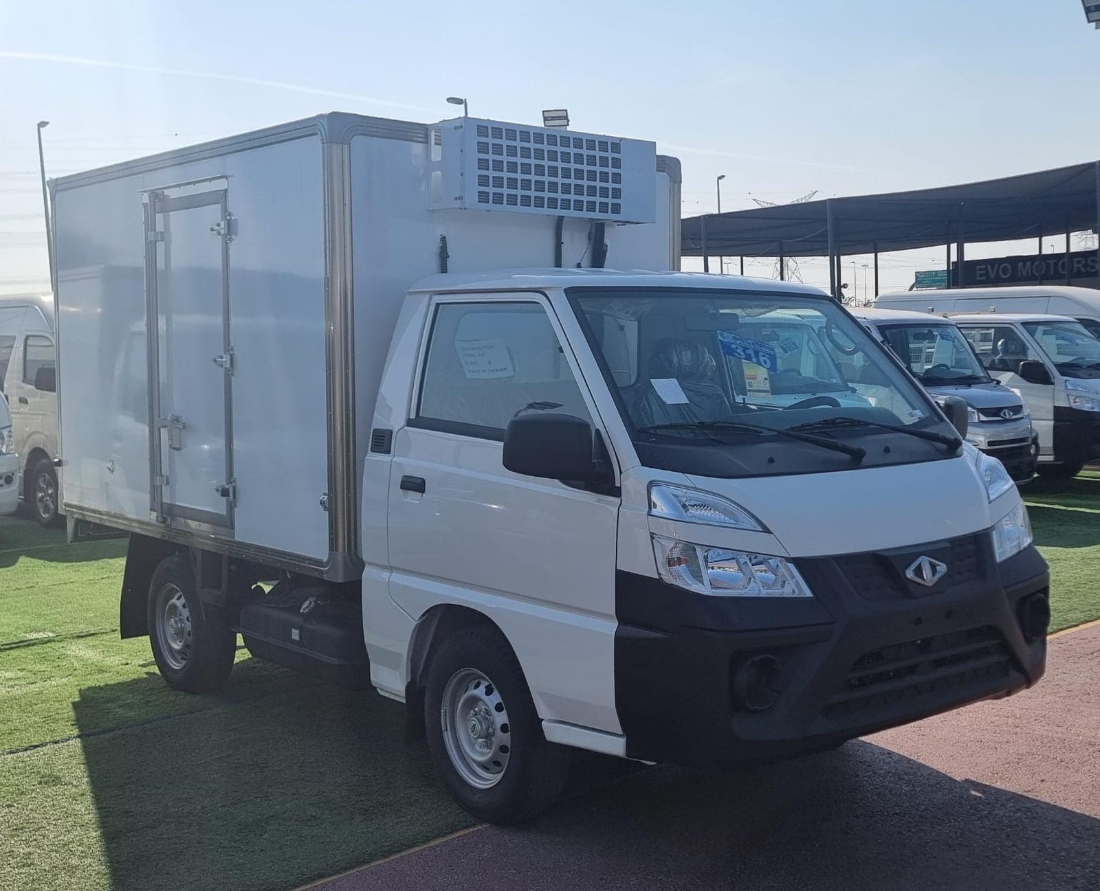 CMC freezer van with roof-mounted refrigeration unit at dealership